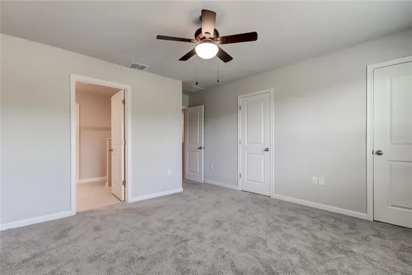 a spacious bathroom with a double vanity sink and mirror