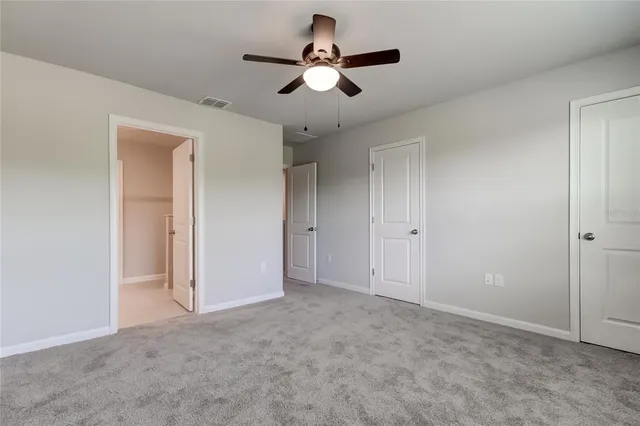 a spacious bathroom with a double vanity sink and mirror