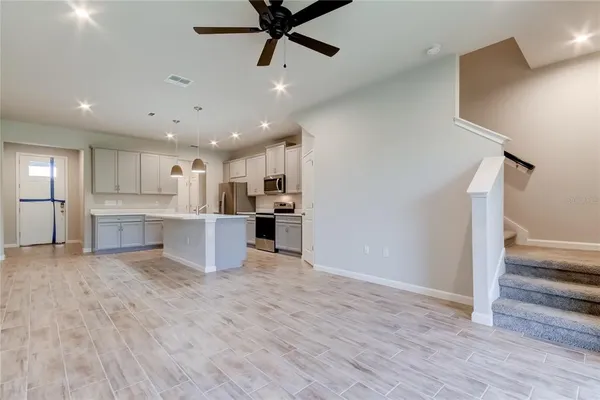 a view of kitchen with wooden floor