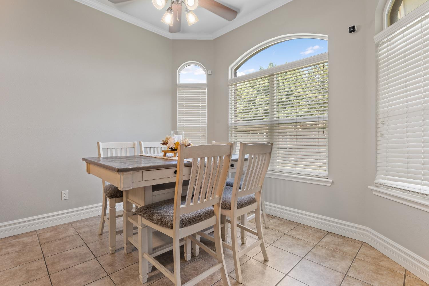 5614 100th Street Lubbock, TX 79424 - Photo 12 of 27 a view of a dining room with furniture and chandelier
