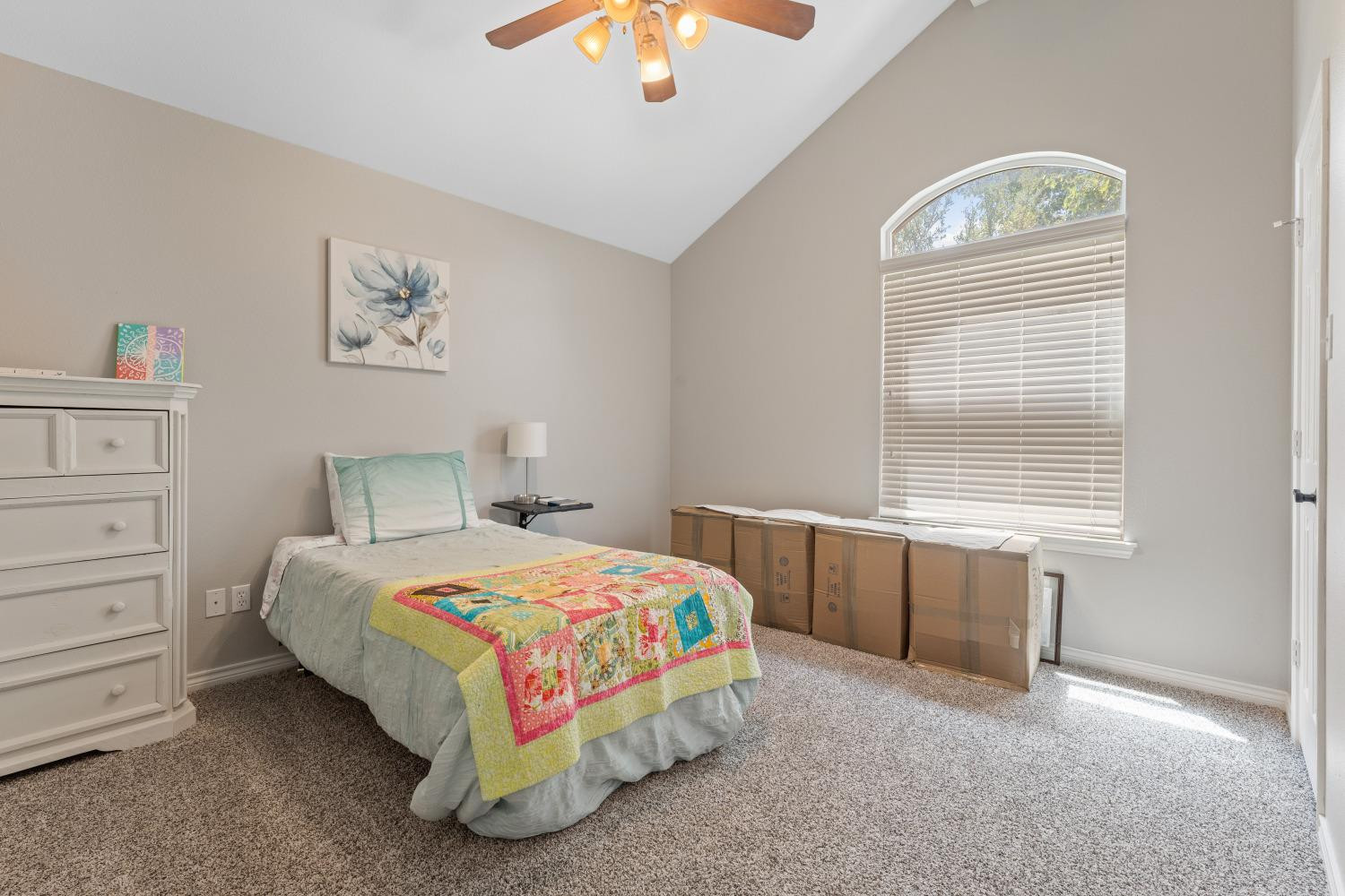 5614 100th Street Lubbock, TX 79424 - Photo 18 of 27 a bedroom with a bed and a window