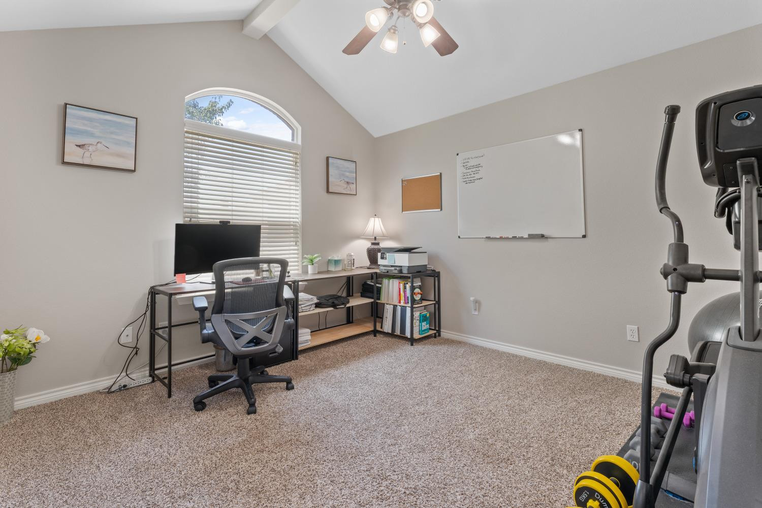 5614 100th Street Lubbock, TX 79424 - Photo 20 of 27 a view of a workspace with furniture and a window
