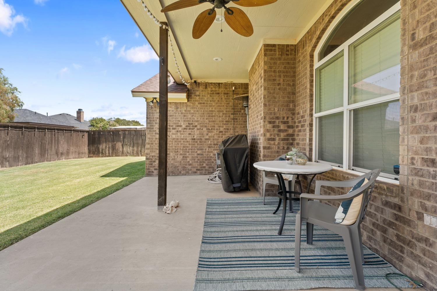 5614 100th Street Lubbock, TX 79424 - Photo 25 of 27 a view of a balcony with table and chairs