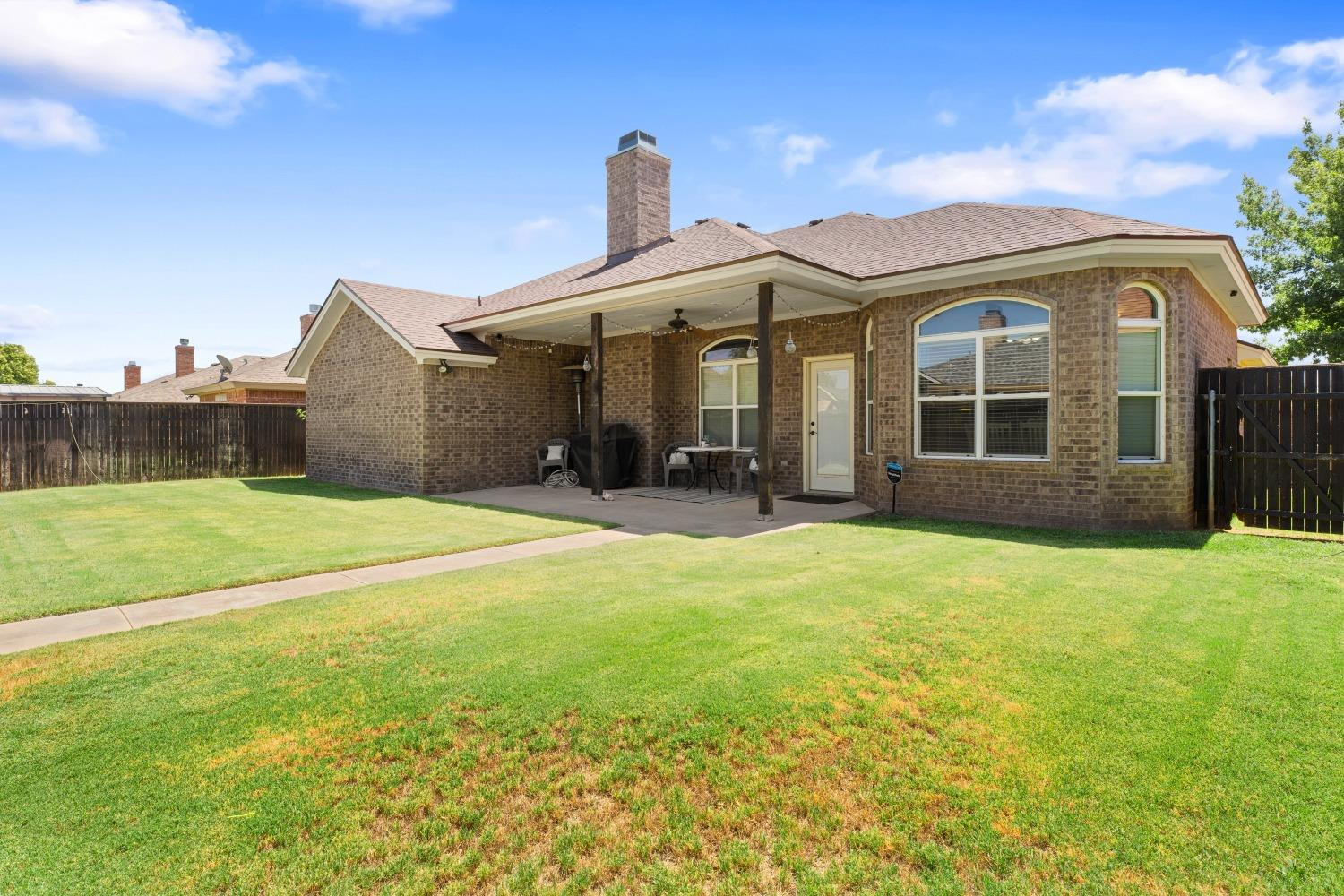 5614 100th Street Lubbock, TX 79424 - Photo 26 of 27 a front view of a house with a yard