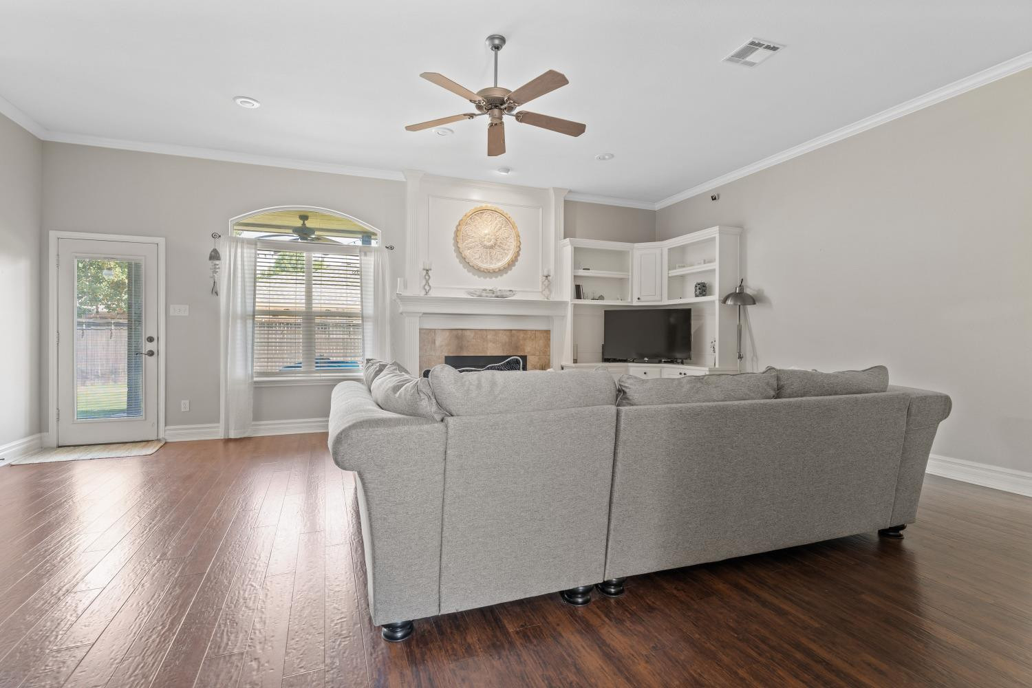 5614 100th Street Lubbock, TX 79424 - Photo 5 of 27 a living room with furniture and a large window