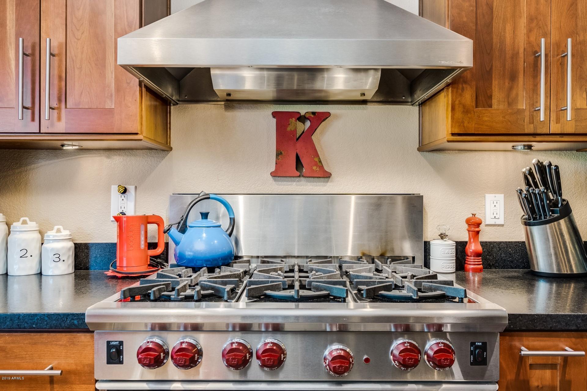 5319 North 15th Street Phoenix, AZ 85014 - Photo 19 of 33 a stove top oven sitting inside of a kitchen