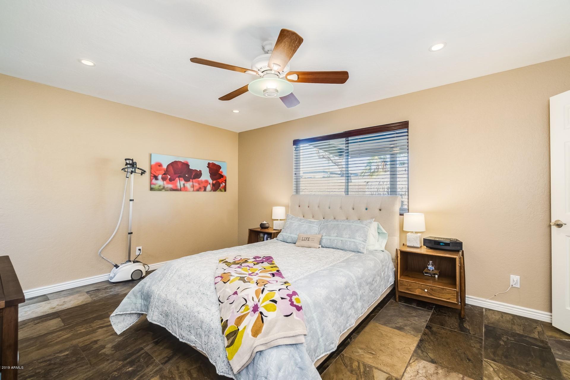 5319 North 15th Street Phoenix, AZ 85014 - Photo 20 of 33 a bedroom with a bed and wooden floor