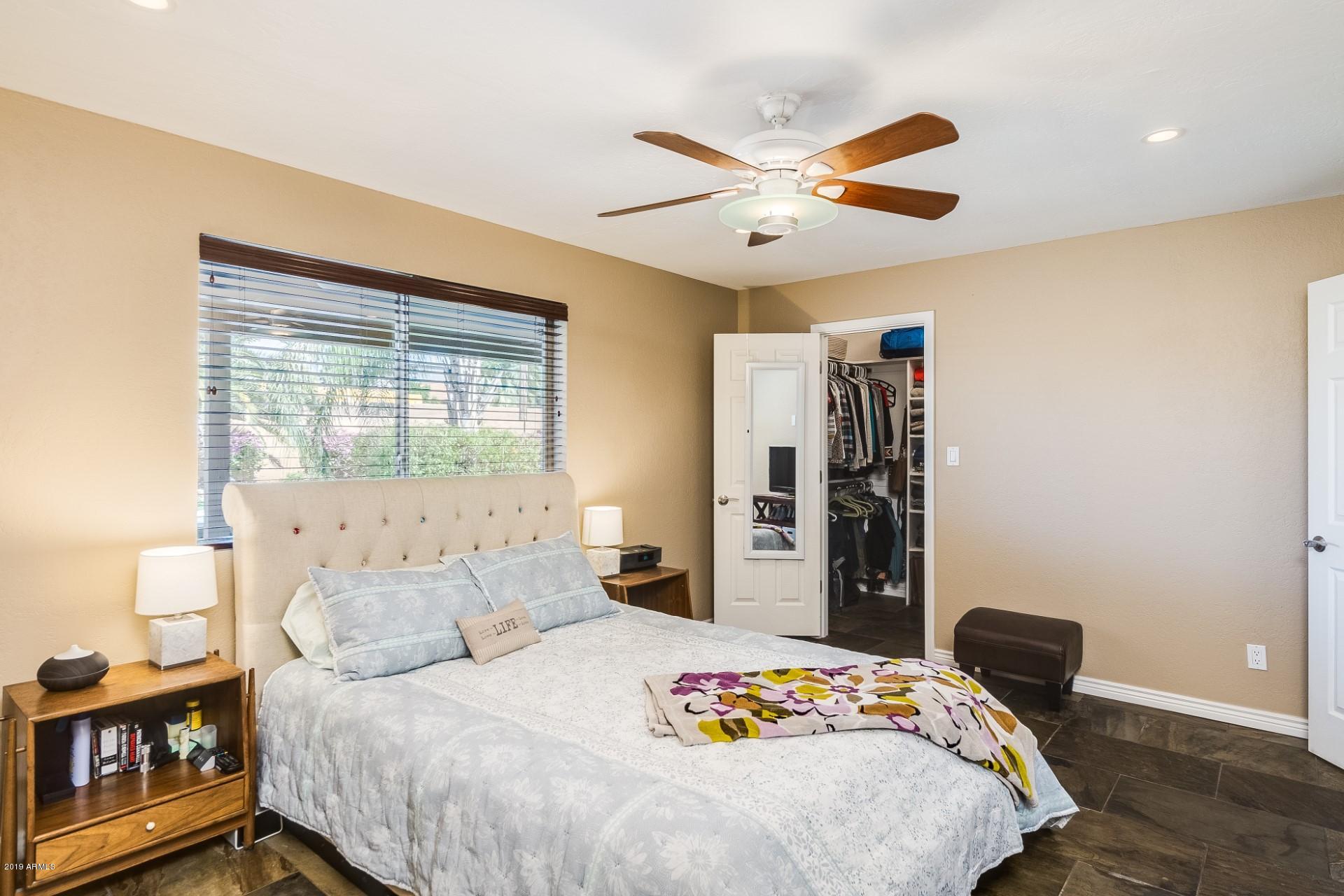 5319 North 15th Street Phoenix, AZ 85014 - Photo 21 of 33 a bedroom with a bed and a table in it