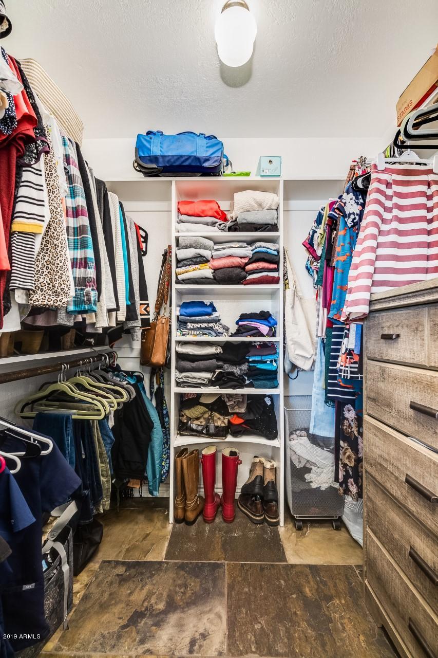 5319 North 15th Street Phoenix, AZ 85014 - Photo 22 of 33 a view of walk in closet with clothes and shoes