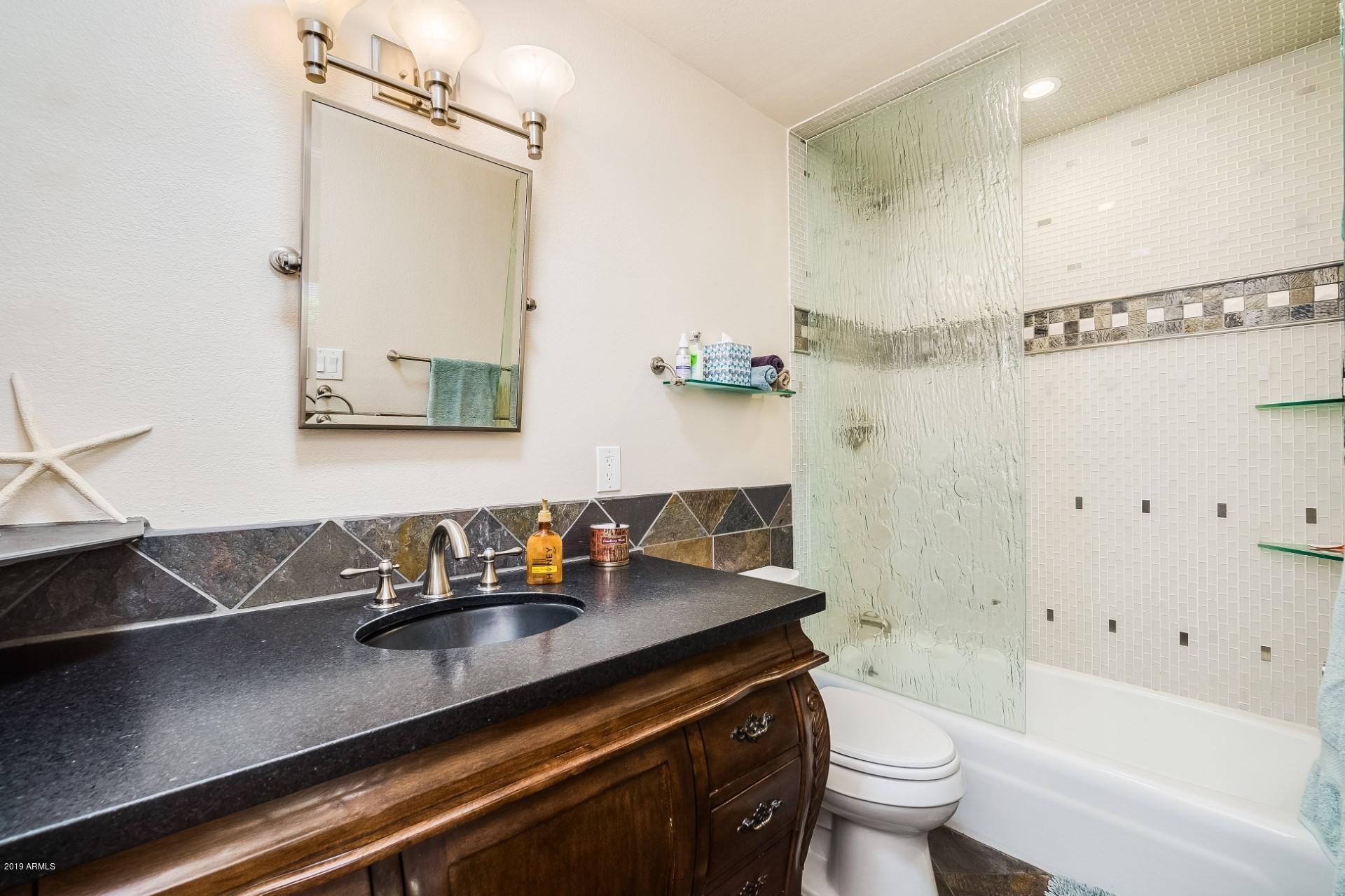 5319 North 15th Street Phoenix, AZ 85014 - Photo 27 of 33 a bathroom with a sink a toilet and shower