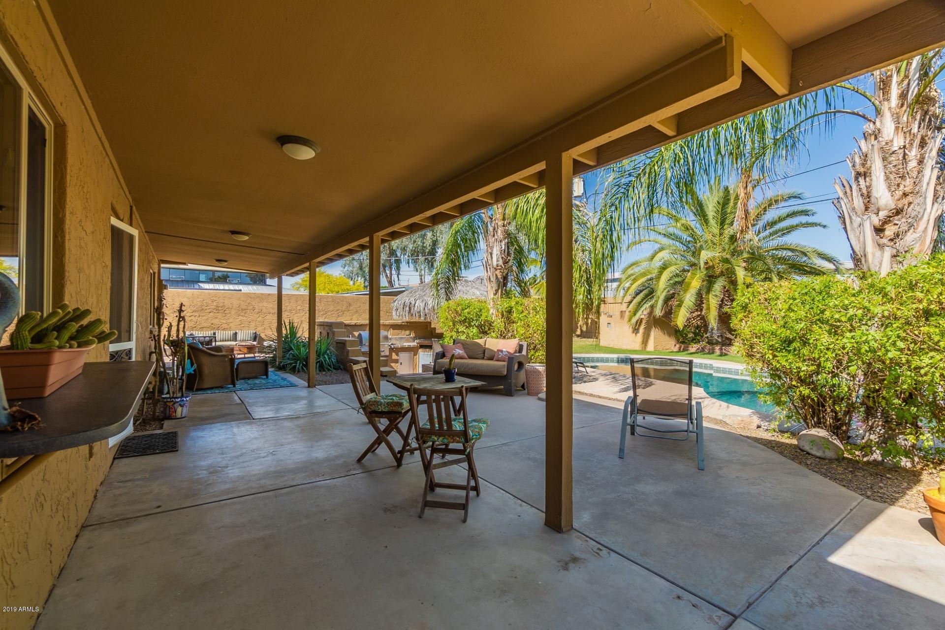 5319 North 15th Street Phoenix, AZ 85014 - Photo 29 of 33 a view of a porch with chairs and backyard