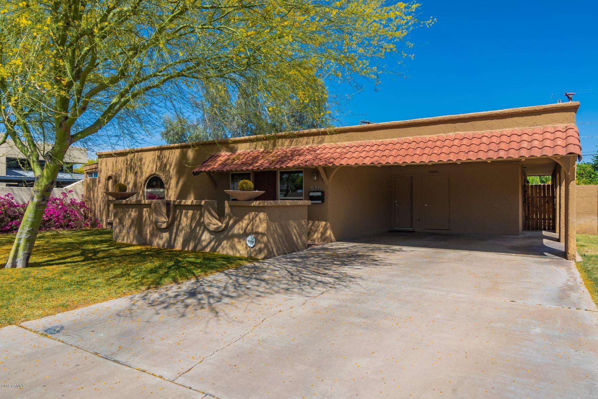 5319 North 15th Street Phoenix, AZ 85014 - Photo 3 of 33 a house with trees in front of it