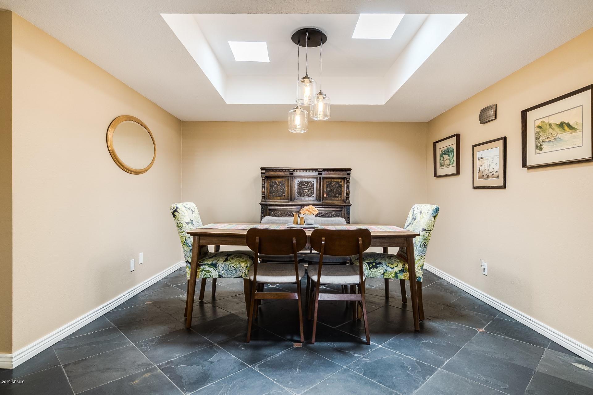 5319 North 15th Street Phoenix, AZ 85014 - Photo 7 of 33 a view of a dining room with furniture and wooden floor