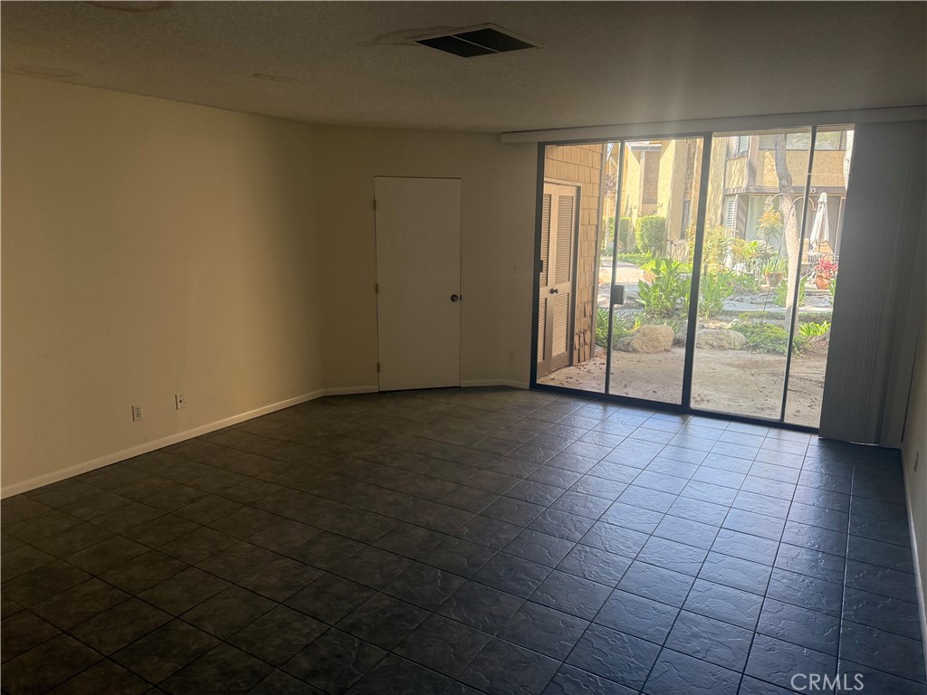 12750 Centralia Street, Unit 191 Lakewood, CA 90715 - Photo 15 of 38 a view of an empty room and window