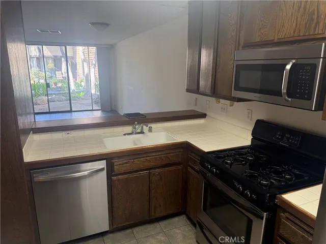 a kitchen with a stove and a microwave