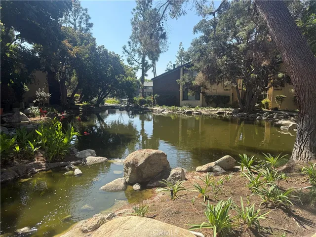 a view of a lake with a house in the background