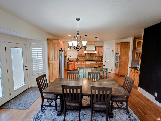 552 Sunset Crest Way Draper, UT 84020 - Photo 8 of 68 Dining room featuring a chandelier, recessed lighting, and light wood-style floors