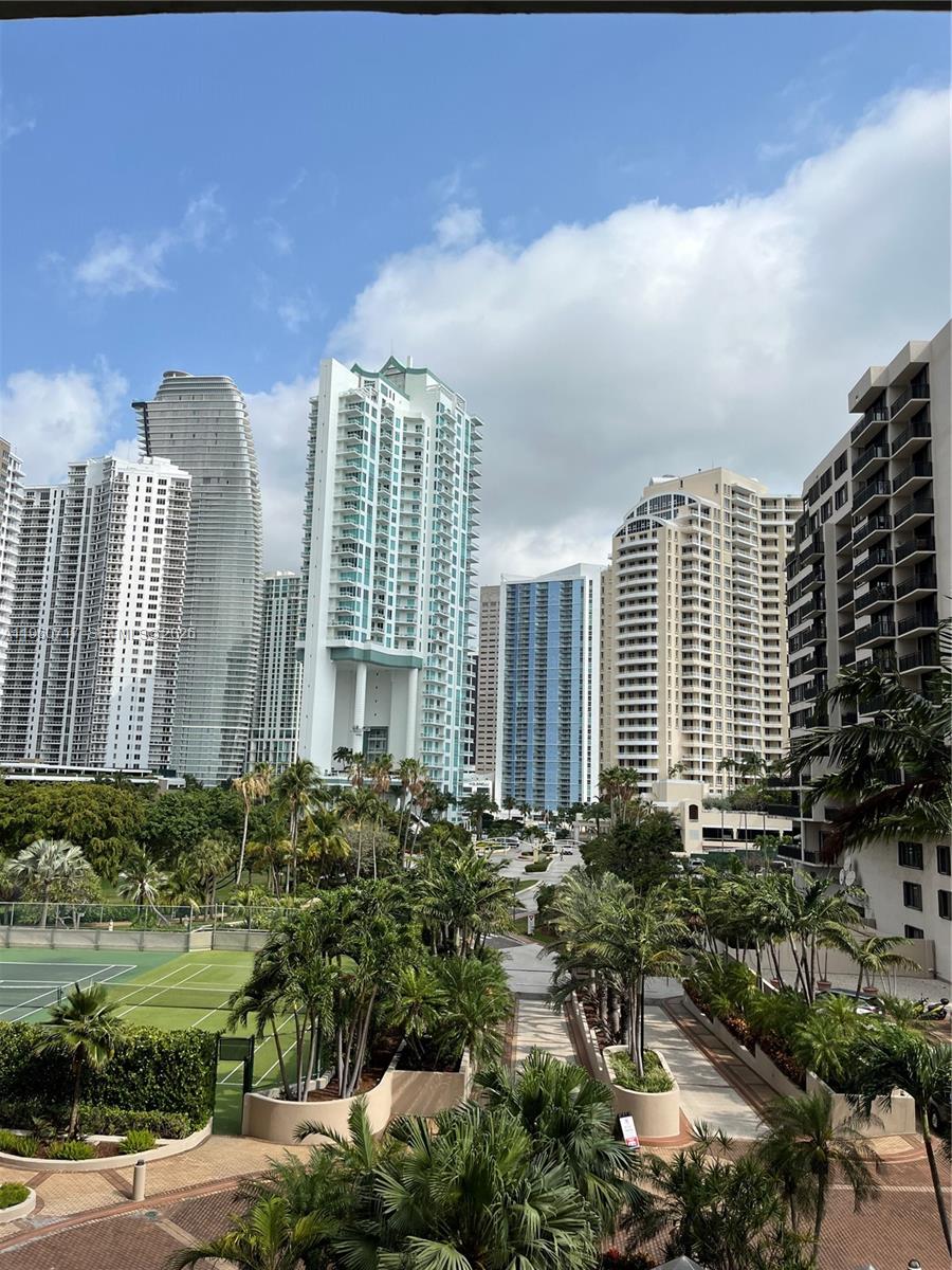 520 Brickell Key Drive, Unit A610 Miami, FL 33131 - Photo 2 of 10 a front view of a building with a garden