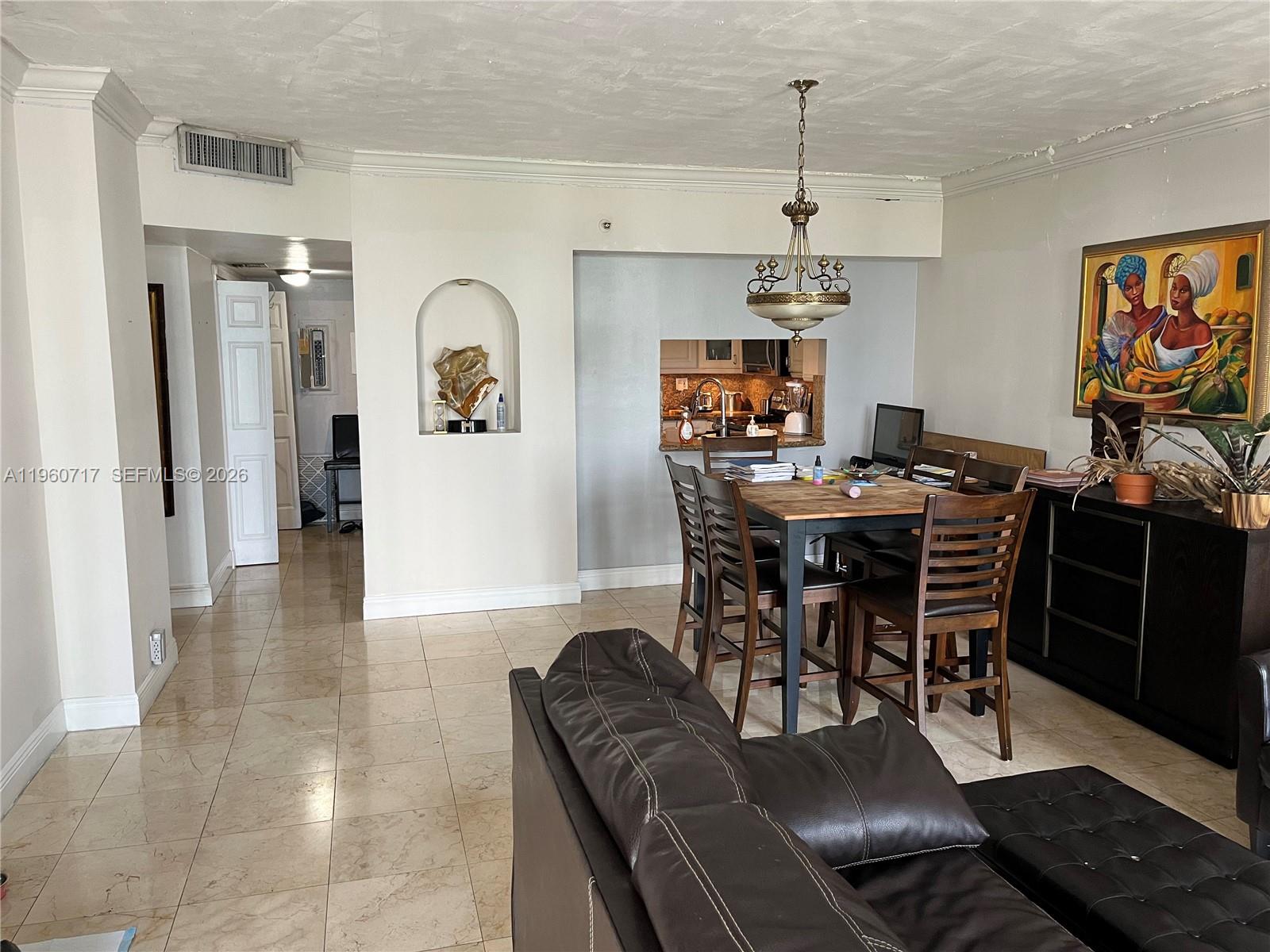 520 Brickell Key Drive, Unit A610 Miami, FL 33131 - Photo 6 of 10 a view of a dining room with furniture