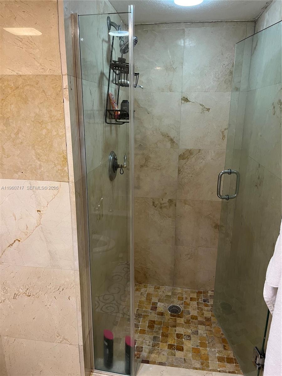 520 Brickell Key Drive, Unit A610 Miami, FL 33131 - Photo 9 of 10 a bathroom with a shower