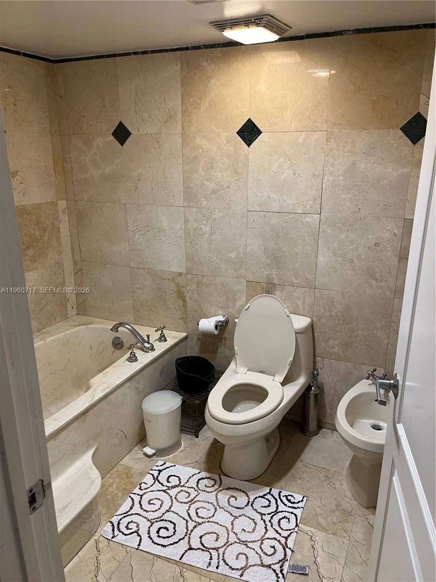 520 Brickell Key Drive, Unit A610 Miami, FL 33131 - Photo 10 of 10 a bathroom with a toilet and a shower