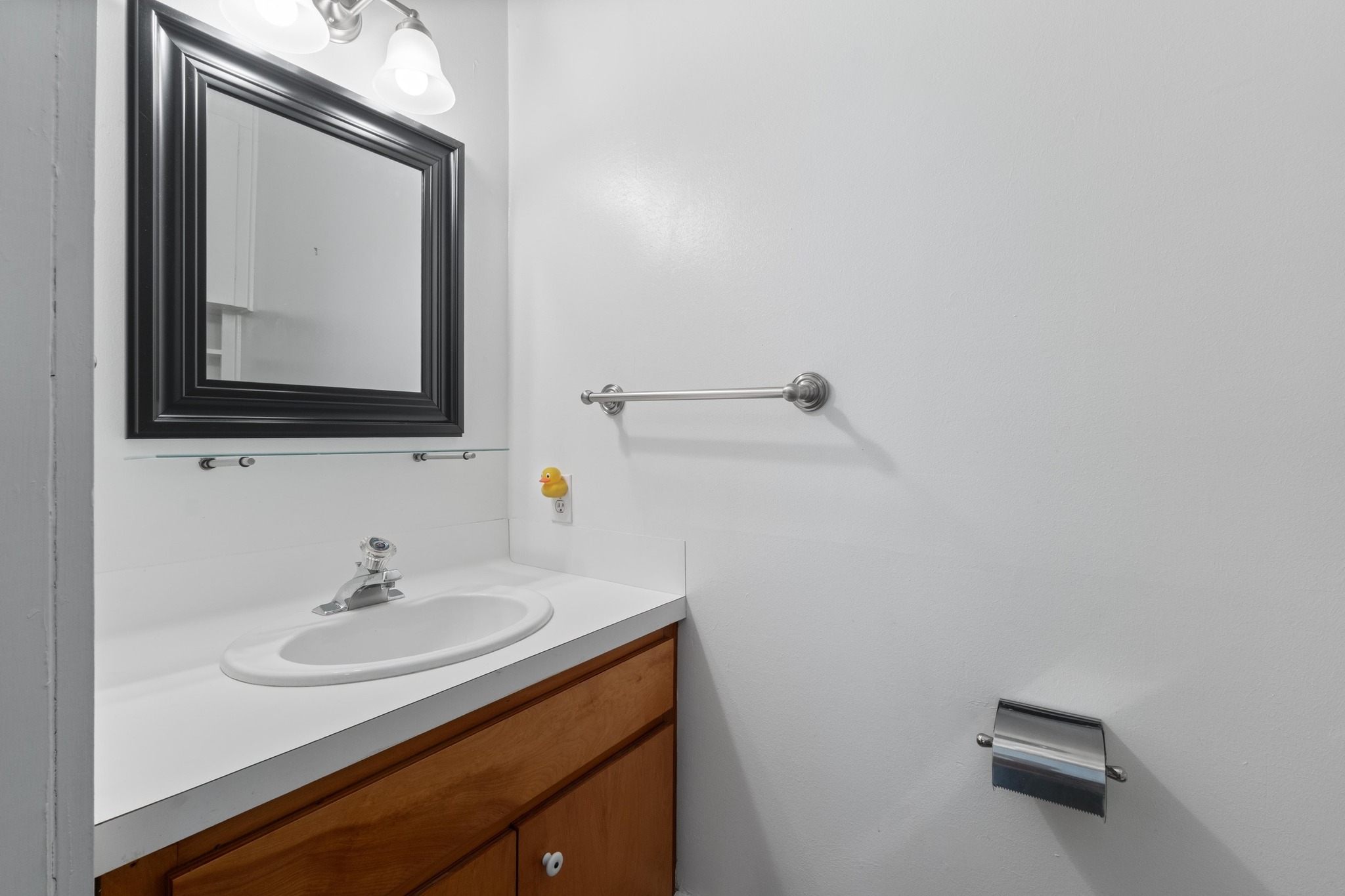 810 East University Avenue Georgetown, TX 78626 - Photo 17 of 38 a bathroom with a sink vanity and a mirror