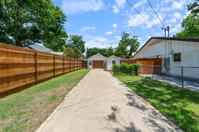 a aerial view of a house with a yard