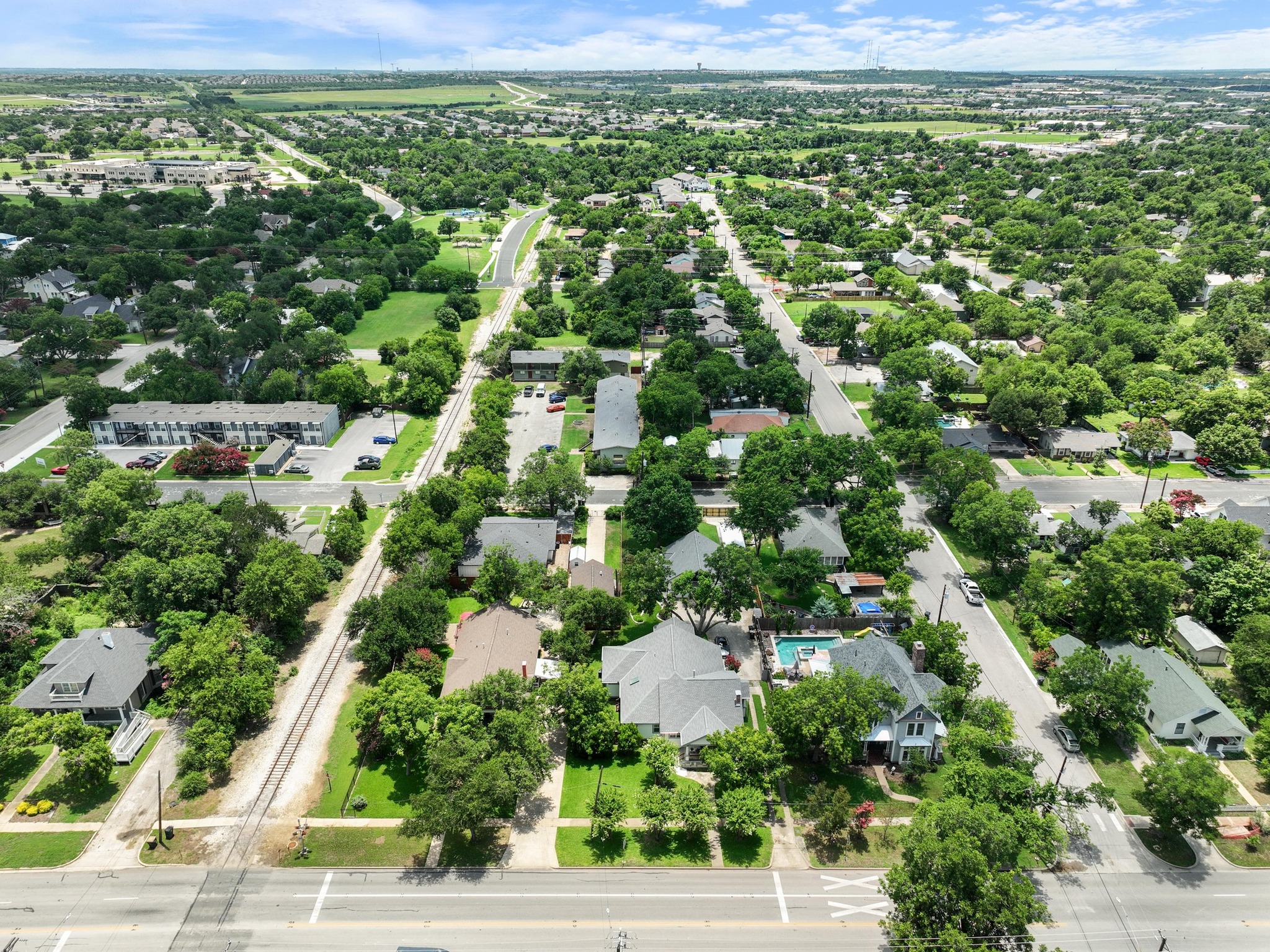 810 East University Avenue Georgetown, TX 78626 - Photo 34 of 38 an aerial view of residential houses with outdoor space and trees