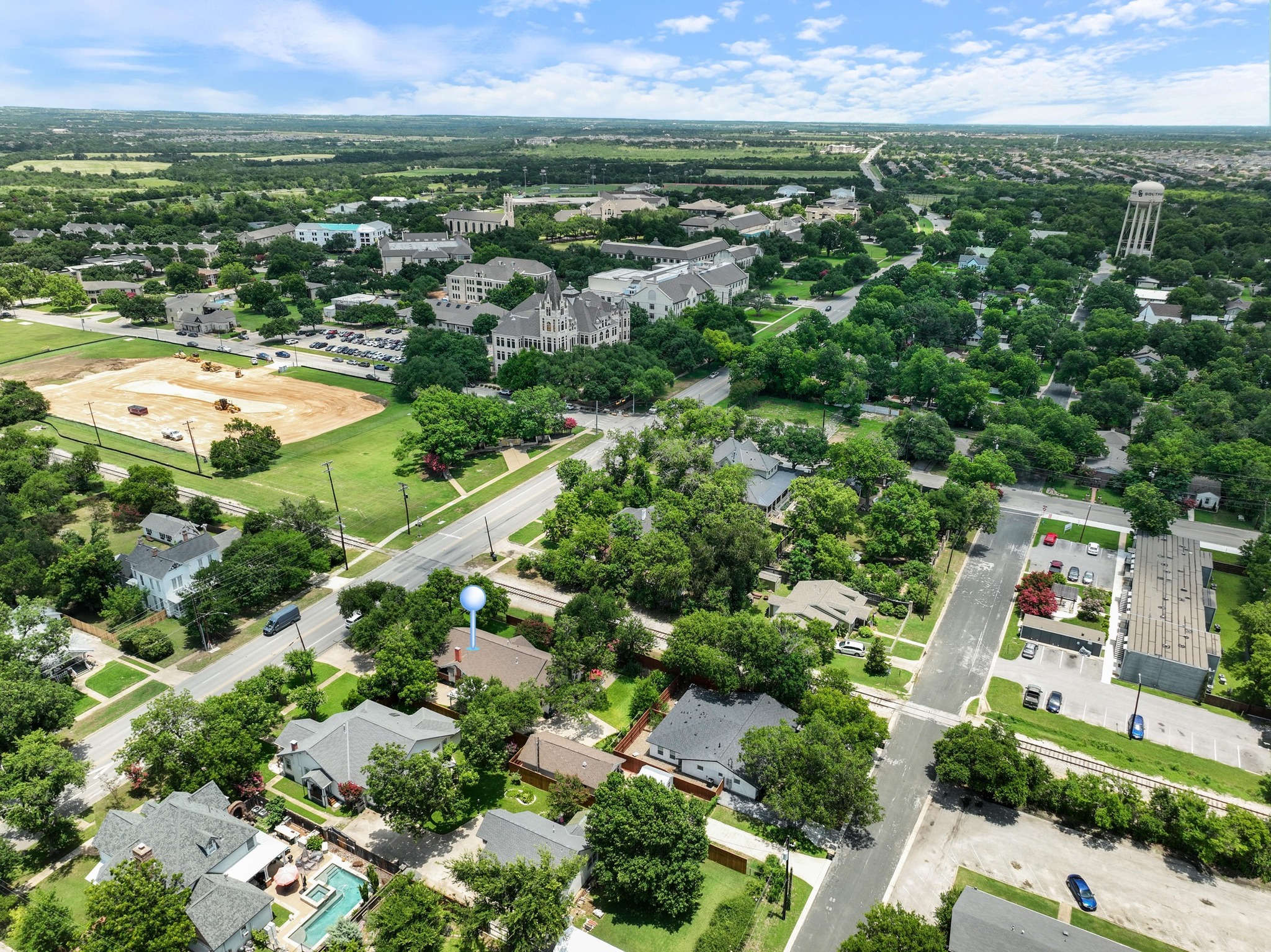 810 East University Avenue Georgetown, TX 78626 - Photo 35 of 38 an aerial view of residential houses with outdoor space and trees