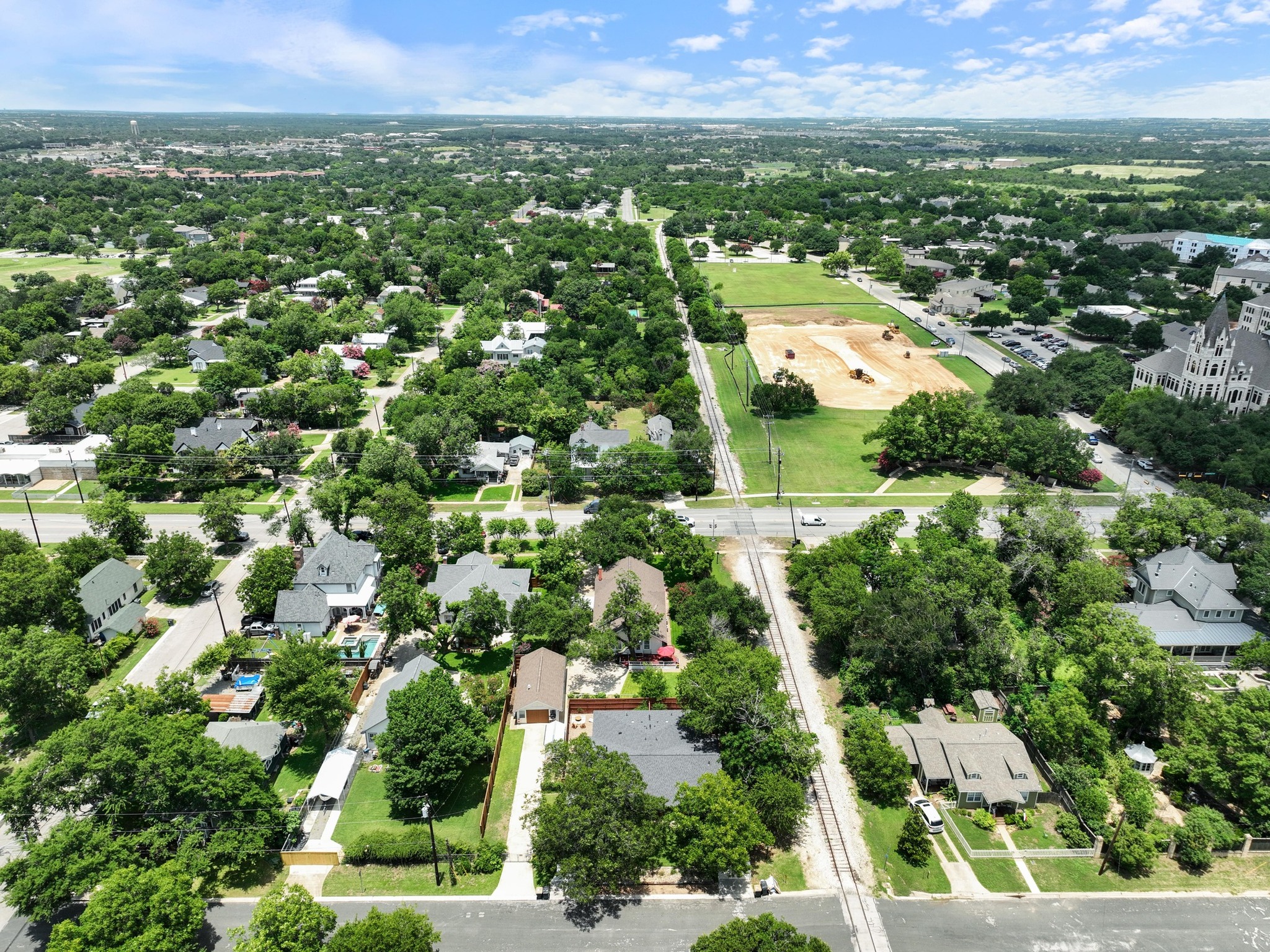 810 East University Avenue Georgetown, TX 78626 - Photo 36 of 38 an aerial view of residential houses with outdoor space and trees
