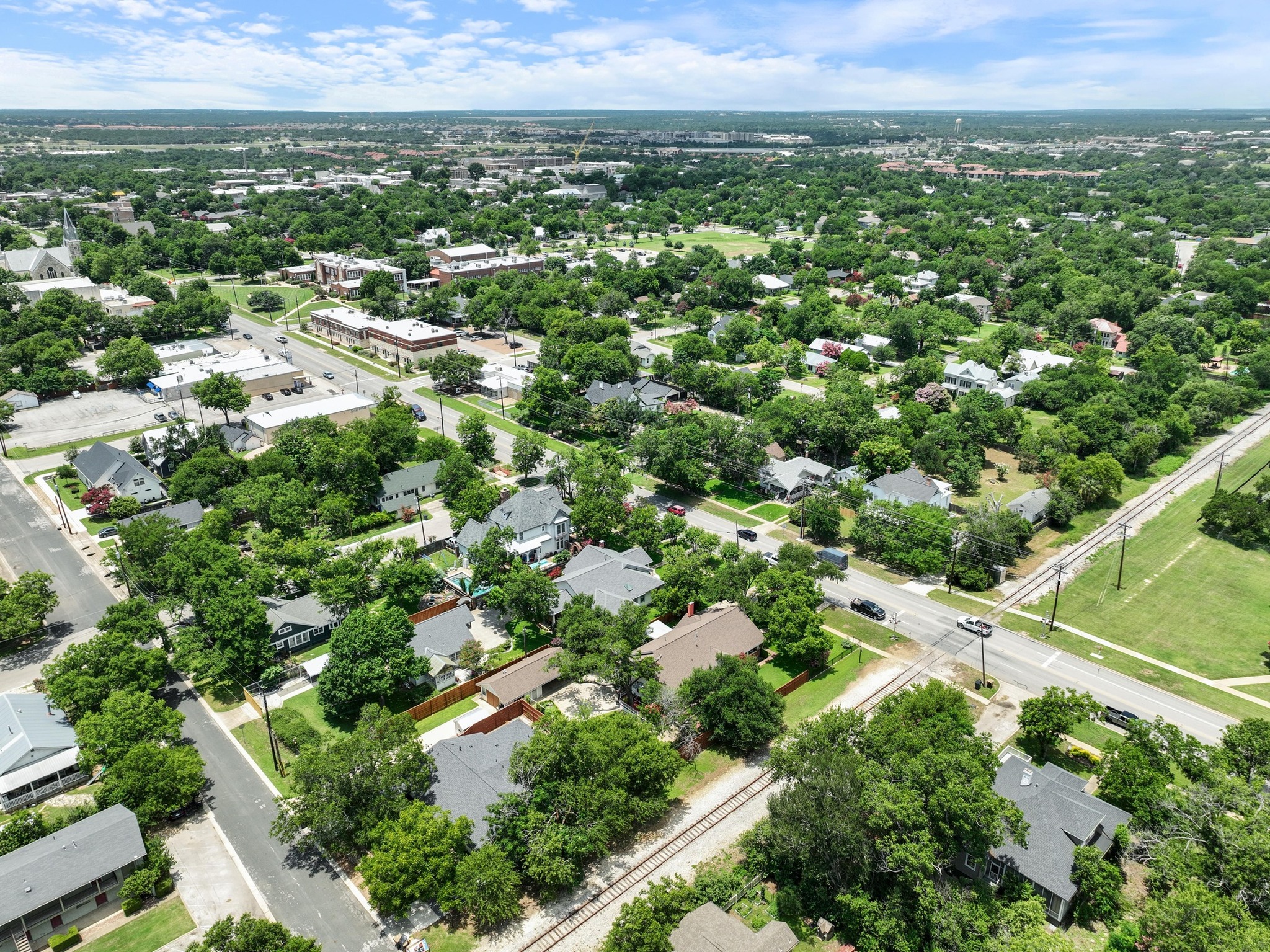 810 East University Avenue Georgetown, TX 78626 - Photo 37 of 38 an aerial view of residential houses with outdoor space and trees