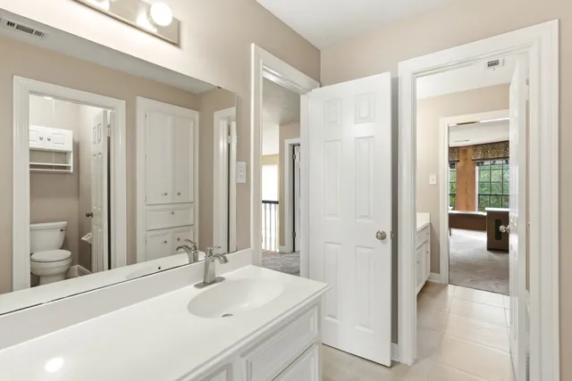 a view of a livingroom with a ceiling fan and window