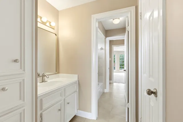 a view of a house with swimming pool and sitting area