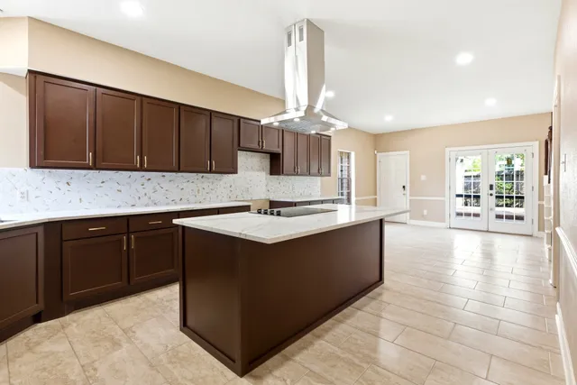 a kitchen with a sink cabinets and window