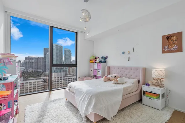 a living room with furniture and a gate