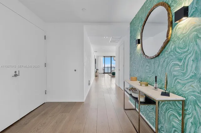 a view of a livingroom with furniture and wooden floor