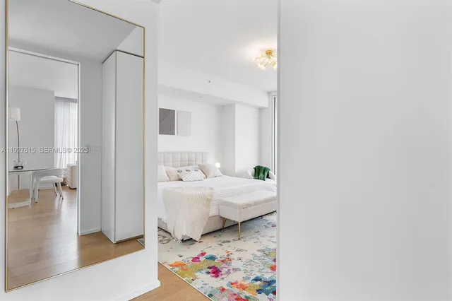 a bathroom with a granite countertop tub and a sink