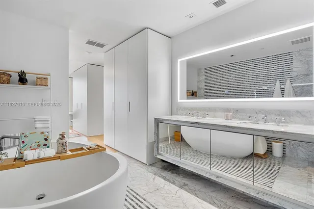 a bathroom with a bathtub and a sink
