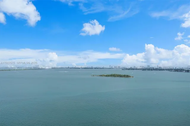a view of a swimming pool and mountain from a balcony