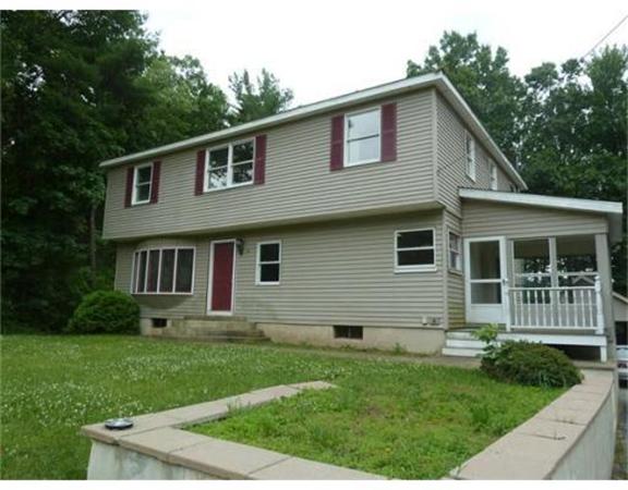 10 Mulpus Road Lunenburg, MA 01462 - Photo 1 of 13 a front view of a house with a yard