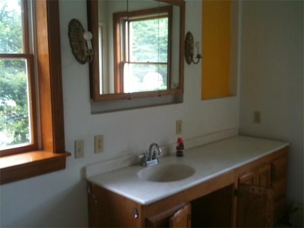 10 Mulpus Road Lunenburg, MA 01462 - Photo 11 of 13 a bathroom with a sink and a window