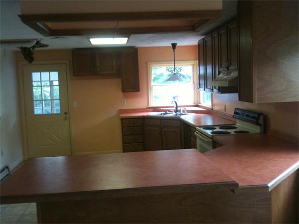 10 Mulpus Road Lunenburg, MA 01462 - Photo 6 of 13 a kitchen with a sink cabinets and a stove top oven