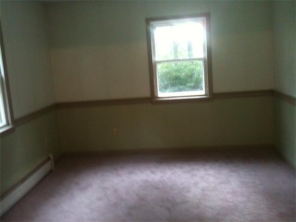 10 Mulpus Road Lunenburg, MA 01462 - Photo 8 of 13 an empty room with a window