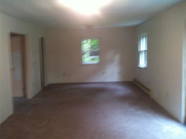 10 Mulpus Road Lunenburg, MA 01462 - Photo 9 of 13 an empty room with windows