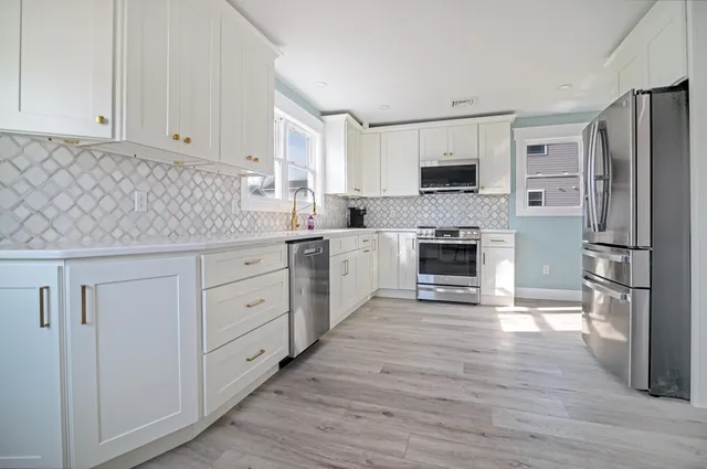 a view of a house with swimming pool and sitting area