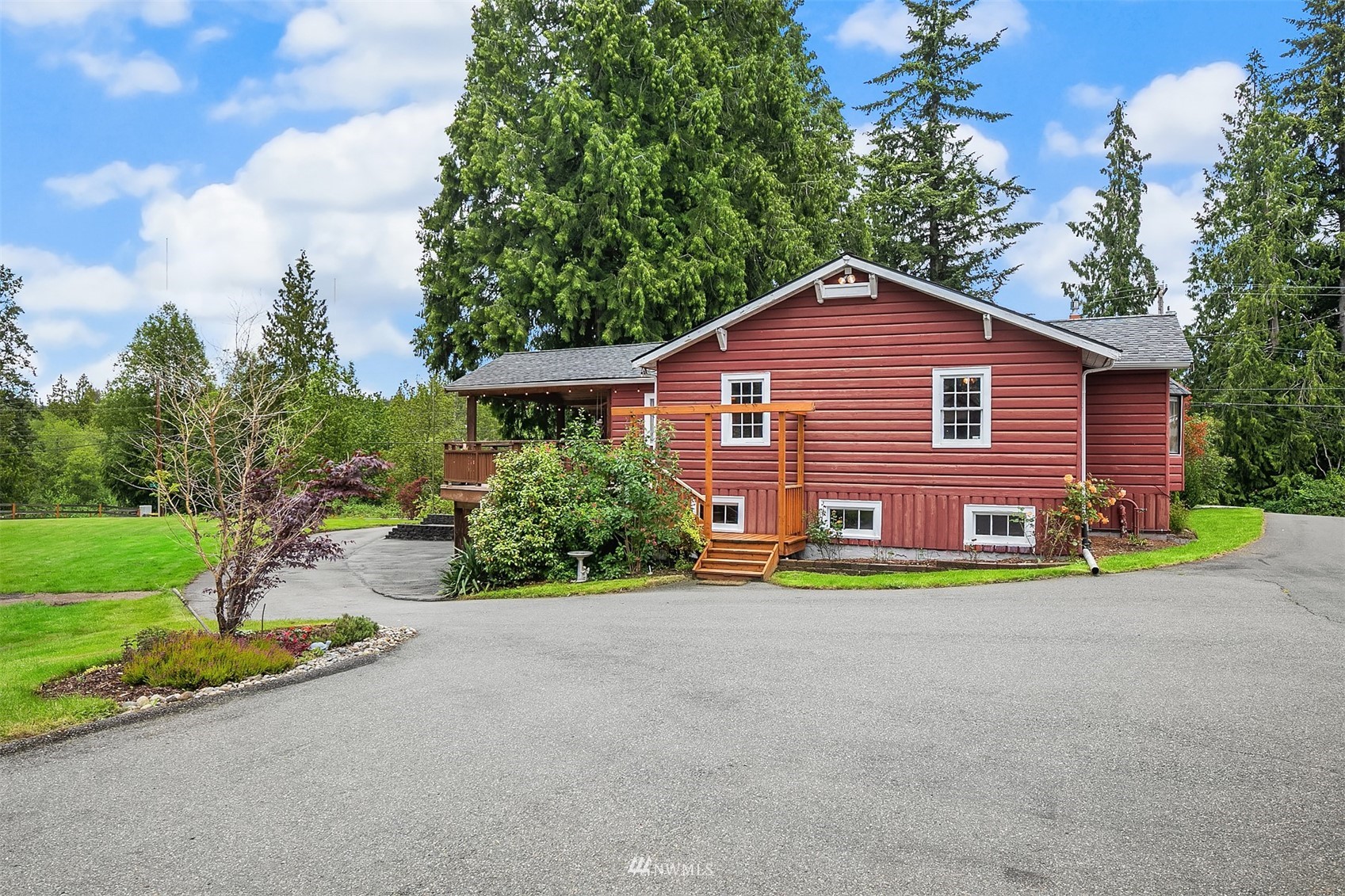 16704 51st Avenue Southeast Bothell, WA 98012 - Photo 4 of 40 a front view of a house with a yard and garage