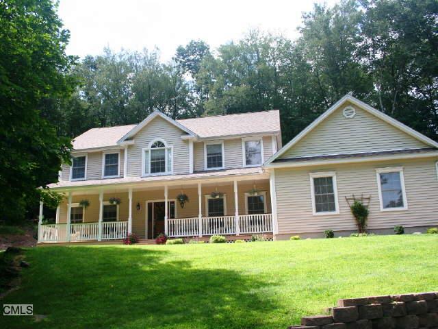 24 Old Bridge Road Brookfield, CT 06804 - Photo 1 of 1 a front view of a house with a garden