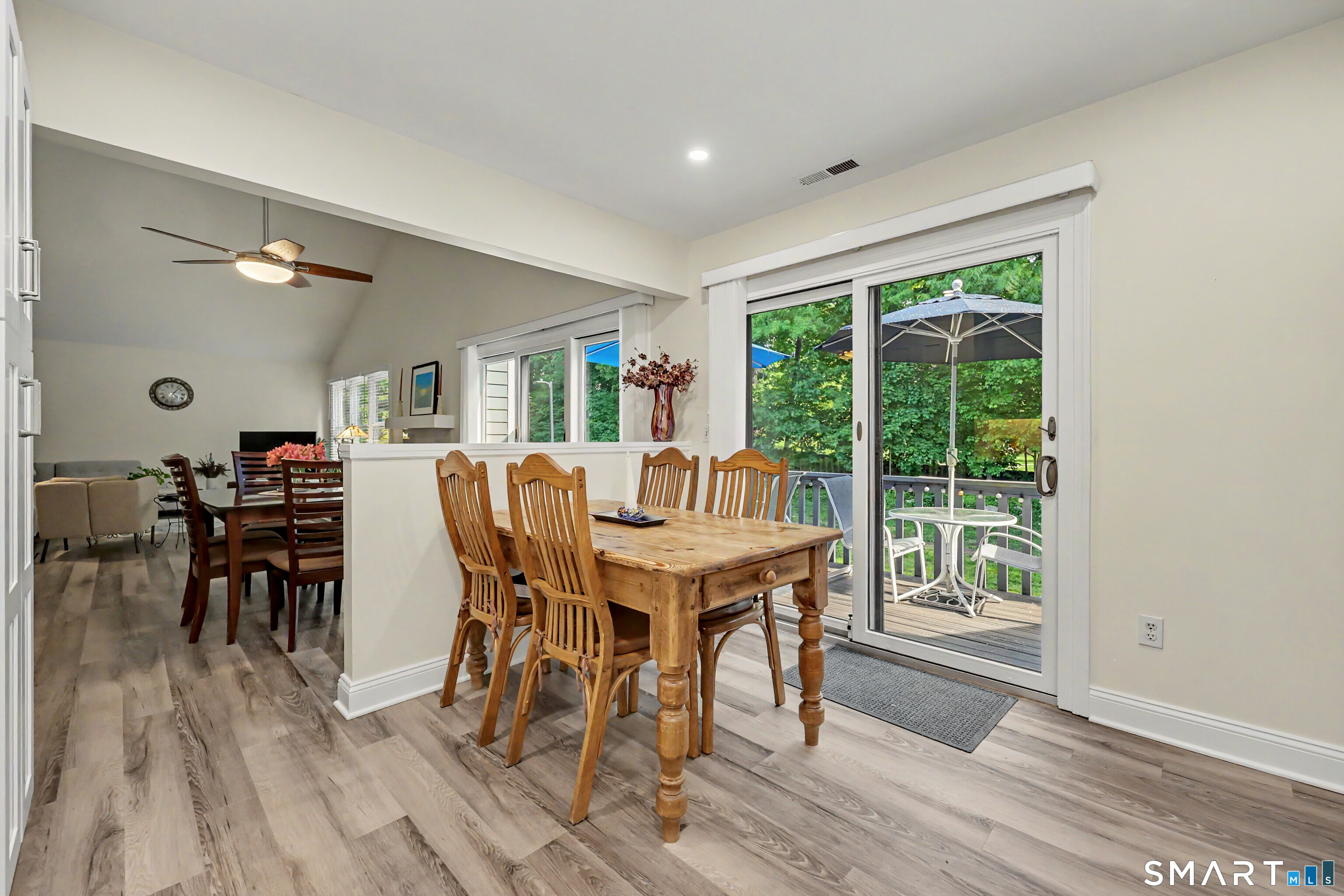 70 Fawn Ridge Lane, Unit 70 Norwalk, CT 06851 - Photo 9 of 36 a view of a dining room with furniture window and wooden floor
