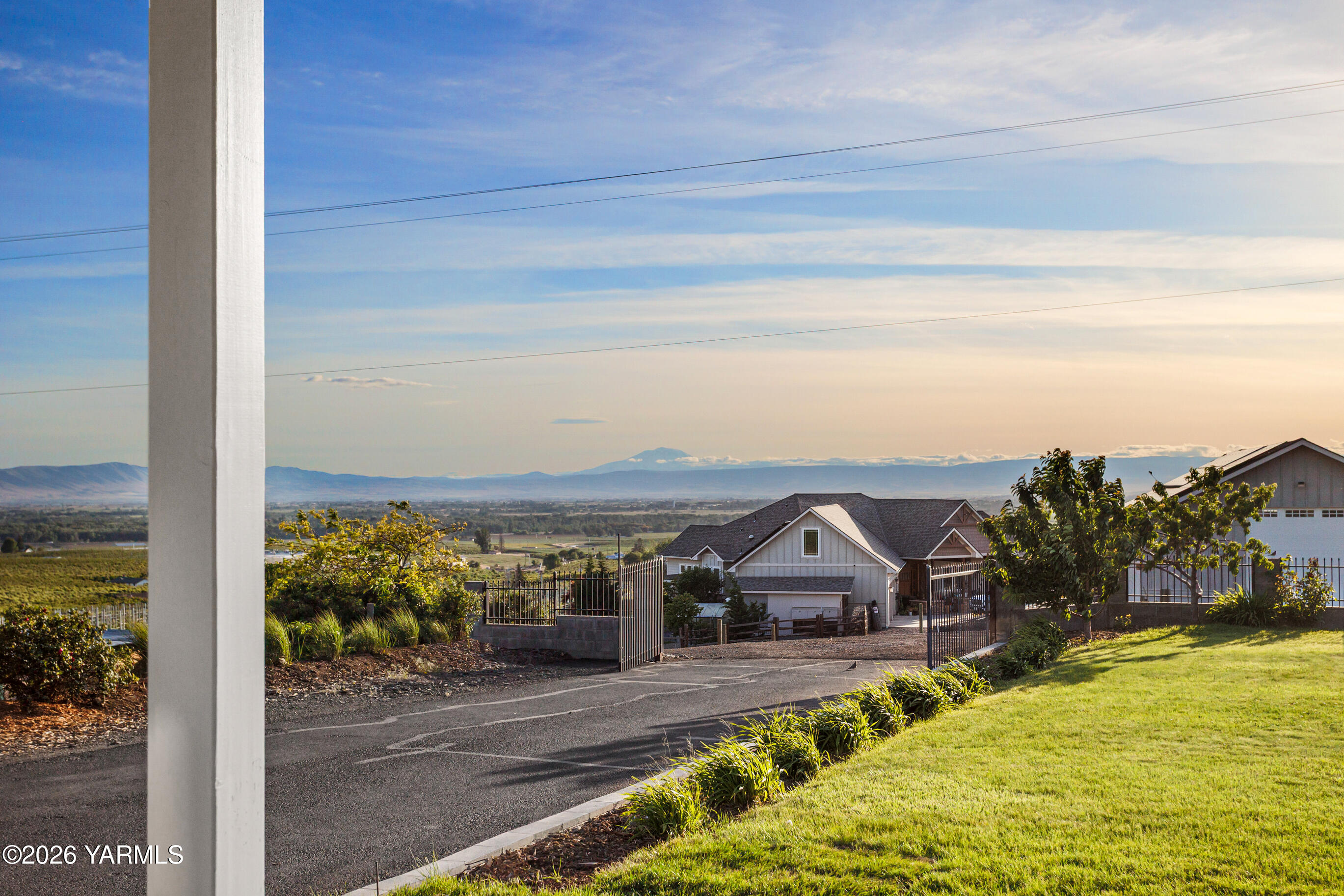 5060 Lombard Loop Road Zillah, WA 98953 - Photo 11 of 65 a view of a big house with a big yard and large tree