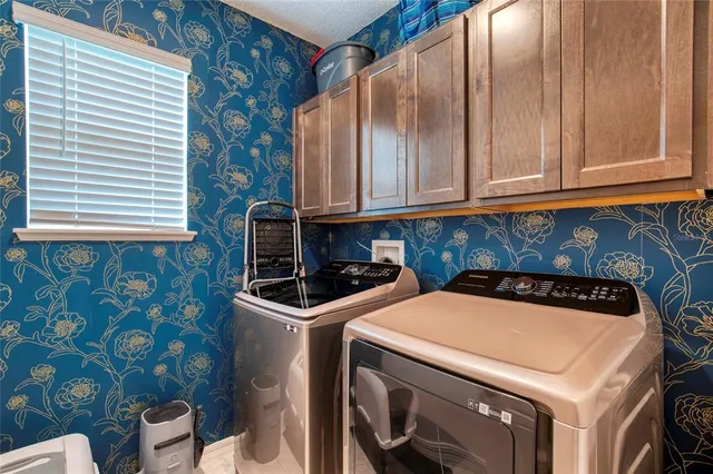 a utility room with dryer and washer
